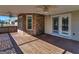 Enclosed wooden back porch with lattice railing, brick pillars, ceiling fan, and access to backyard at 105 Overlook Dr, Mcdonough, GA 30252