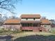 Exterior view of the back of the home with a covered back porch and spacious yard at 105 Overlook Dr, Mcdonough, GA 30252