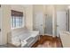 Bathroom featuring a large soaking tub, tile accents, and separate shower at 105 Overlook Dr, Mcdonough, GA 30252