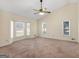 Generous bedroom with vaulted ceiling and ample natural light from multiple windows at 105 Overlook Dr, Mcdonough, GA 30252