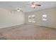 Large bonus room featuring carpet, ceiling fans, and a door to outside at 105 Overlook Dr, Mcdonough, GA 30252