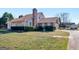 Charming exterior view of a beautiful home featuring a brick chimney and well-manicured lawn at 105 Overlook Dr, Mcdonough, GA 30252