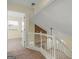 Bright hallway with view into bedroom and brick fireplace on second floor at 105 Overlook Dr, Mcdonough, GA 30252