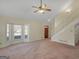Inviting living area featuring a bay window, staircase, and a classic wooden front door at 105 Overlook Dr, Mcdonough, GA 30252