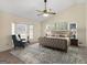 Bright bedroom with vaulted ceiling, bay window, ceiling fan, and a coordinated furniture set at 105 Overlook Dr, Mcdonough, GA 30252