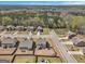 An aerial view of a suburban neighborhood featuring many houses and green foliage at 1734 Tricklin Spgs, Mcdonough, GA 30252
