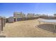 A fully fenced backyard with storage shed, trampoline and manicured grass at 1734 Tricklin Spgs, Mcdonough, GA 30252