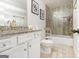 Cozy bathroom with tiled shower, white vanity, and marble countertop at 1734 Tricklin Spgs, Mcdonough, GA 30252