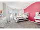 Bright bedroom with lots of light featuring a bed with tufted headboard and white vanity at 1734 Tricklin Spgs, Mcdonough, GA 30252