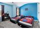 Fun bedroom featuring two themed beds, colorful walls, and bright natural lighting at 1734 Tricklin Spgs, Mcdonough, GA 30252