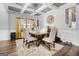 Elegant dining room boasting coffered ceilings, a wooden table with seating for four, and modern decor at 1734 Tricklin Spgs, Mcdonough, GA 30252
