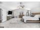 Primary bedroom features a vaulted ceiling, soft carpet, and serene color palette with an adjoining sitting area at 1734 Tricklin Spgs, Mcdonough, GA 30252