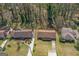 Aerial view shows a neighborhood with single-Gathering homes with mature trees and well-manicured lawns at 447 Wavelyn Way, Riverdale, GA 30274