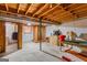 Unfinished basement space with exposed ceiling, concrete flooring, and utilities at 447 Wavelyn Way, Riverdale, GA 30274