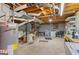 Unfinished basement with utilities, laundry area, exposed ductwork, and storage space at 447 Wavelyn Way, Riverdale, GA 30274