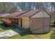This charming ranch features classic brick construction, a convenient attached garage, and a well-maintained yard at 447 Wavelyn Way, Riverdale, GA 30274