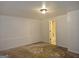 Bare basement space shows doorway to a bath and is ready for renovation at 89 Farm Brook Ln # 17, Dallas, GA 30157