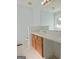 Bathroom vanity featuring a sink, neutral paint, tile floors, and a large mirror at 89 Farm Brook Ln # 17, Dallas, GA 30157