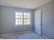 Bright bedroom with a double-hung window offering natural light at 89 Farm Brook Ln # 17, Dallas, GA 30157