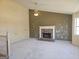 Spacious living room featuring vaulted ceiling, stone fireplace, ceiling fan and a window at 89 Farm Brook Ln # 17, Dallas, GA 30157