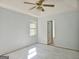 Spacious Main bedroom with neutral paint, ceiling fan and tile floors at 89 Farm Brook Ln # 17, Dallas, GA 30157