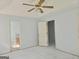 Spacious Main bedroom with neutral paint, ceiling fan, tile floors and ensuite bathroom at 89 Farm Brook Ln # 17, Dallas, GA 30157