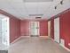 Spacious room with paneled wall featuring recessed lights and double doors at 89 Farm Brook Ln # 17, Dallas, GA 30157