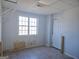 Unfinished room with a window allowing natural light and a white door at 89 Farm Brook Ln # 17, Dallas, GA 30157