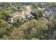 Scenic aerial view of homes nestled among lush trees and a tranquil pond, providing a peaceful neighborhood setting at 237 Summerford Pl, Stockbridge, GA 30281