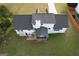 Aerial view of a home's backyard featuring a screened porch and ample green space for outdoor activities at 237 Summerford Pl, Stockbridge, GA 30281