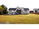 Spacious backyard with a screened porch, creating an ideal outdoor living and entertainment space at 237 Summerford Pl, Stockbridge, GA 30281