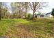 The spacious backyard has a gentle slope, mature trees and a shed, offering a private outdoor retreat at 237 Summerford Pl, Stockbridge, GA 30281