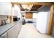 Basement with kitchenette featuring grey cabinets and includes space for a refrigerator and work out area at 237 Summerford Pl, Stockbridge, GA 30281