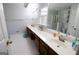 Bright bathroom with a long vanity, white countertops, and separate shower at 237 Summerford Pl, Stockbridge, GA 30281