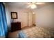 Bedroom with view of double closet, ceiling fan, and a wood dresser at 237 Summerford Pl, Stockbridge, GA 30281