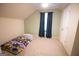 Comfortable bedroom with plush carpet, natural light, and a cheerful, vehicle-themed bedspread at 237 Summerford Pl, Stockbridge, GA 30281