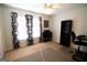 Bonus room with a large window, sleek black bookcase, and a comfortable chair at 237 Summerford Pl, Stockbridge, GA 30281