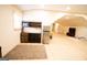 Bonus room with wood floors featuring kitchen area, and play area at 237 Summerford Pl, Stockbridge, GA 30281