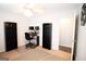 Bonus room featuring dual monitors, ceiling fan, and an open doorway at 237 Summerford Pl, Stockbridge, GA 30281