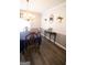 Bright dining room featuring hardwood floors, modern wainscoting and an elegant chandelier at 237 Summerford Pl, Stockbridge, GA 30281