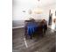 Cozy dining room boasts a chandelier, wall decor, and adjacent view of the kitchen at 237 Summerford Pl, Stockbridge, GA 30281