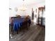 An elegant dining room features hardwood floors and a view into an adjacent kitchen at 237 Summerford Pl, Stockbridge, GA 30281