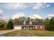 Charming, single-story brick home featuring a two-car garage and dormer windows at 237 Summerford Pl, Stockbridge, GA 30281
