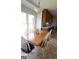 Eat-in kitchen features a wood dining table and white chairs, illuminated by a modern light fixture at 237 Summerford Pl, Stockbridge, GA 30281