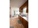 Functional kitchen with wood cabinets, stainless sink, and ample countertop space at 237 Summerford Pl, Stockbridge, GA 30281