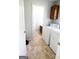 Bright laundry room equipped with white washer and dryer units plus overhead storage at 237 Summerford Pl, Stockbridge, GA 30281