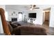 Bright living room boasts a fireplace, modern flooring, and a ceiling fan at 237 Summerford Pl, Stockbridge, GA 30281