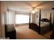 Spacious main bedroom features a carpeted floor and a classic four-poster bed at 237 Summerford Pl, Stockbridge, GA 30281