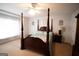 A main bedroom with a four poster bed, ceiling fan, and light-filled window at 237 Summerford Pl, Stockbridge, GA 30281