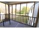 Relax on the screened porch with views of the lawn and surrounding trees at 237 Summerford Pl, Stockbridge, GA 30281